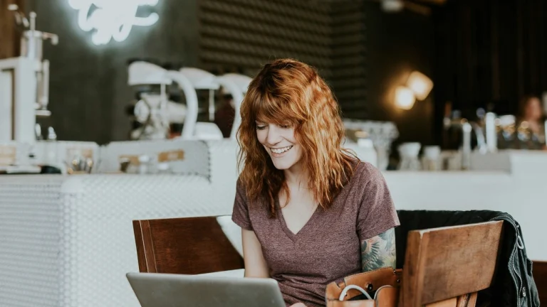 Woman enjoying laptop time in cozy cafe