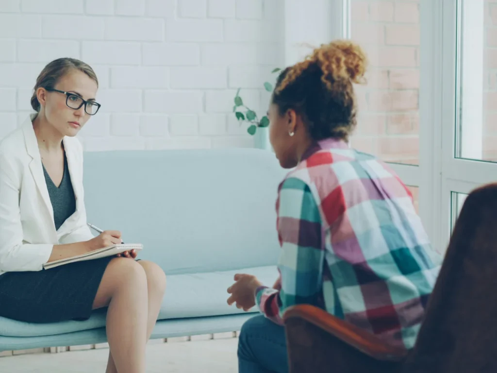 Therapist listening to a client during treatment for complex PTSD