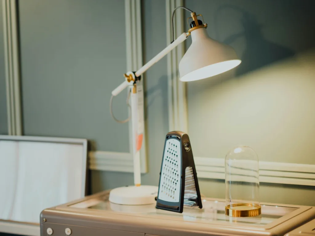 Desk lamp on a wooden table, an example of artificial light used during winter